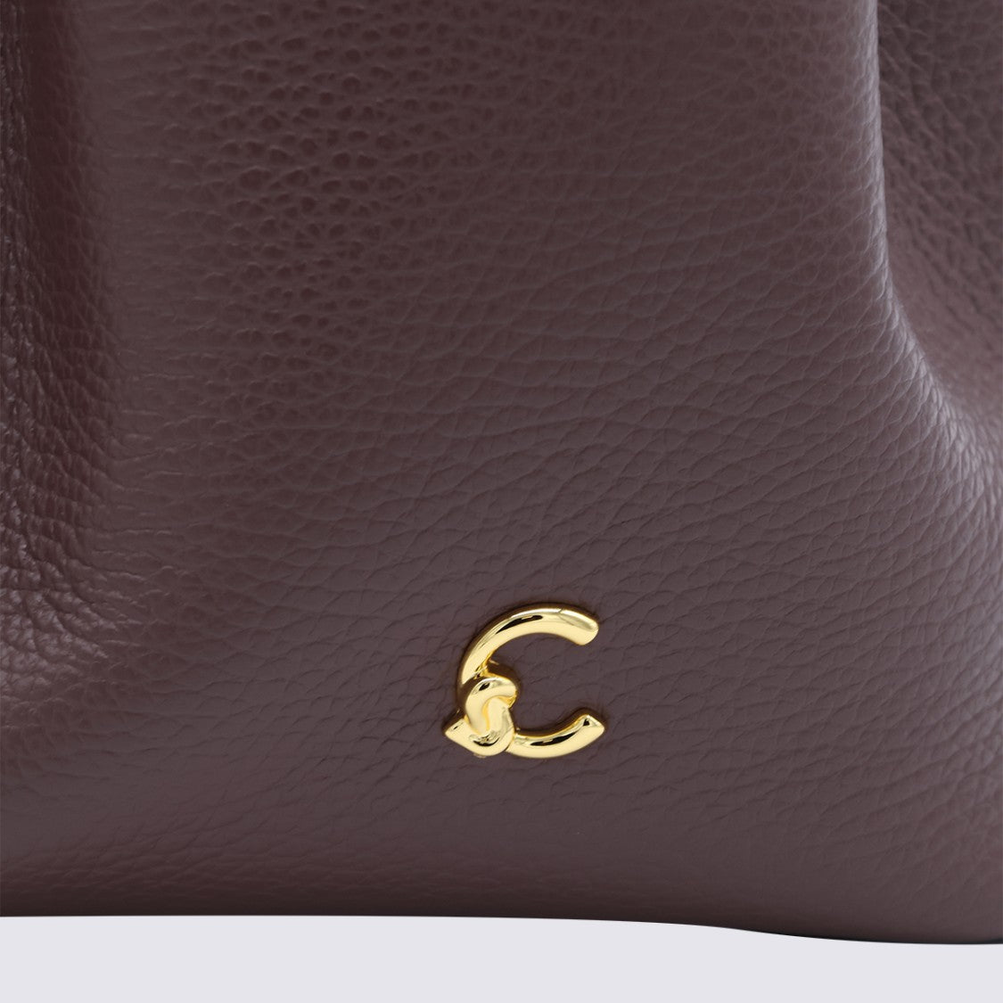Coccinelle Pebbled Leather Handbag With Versatile Carrying Options