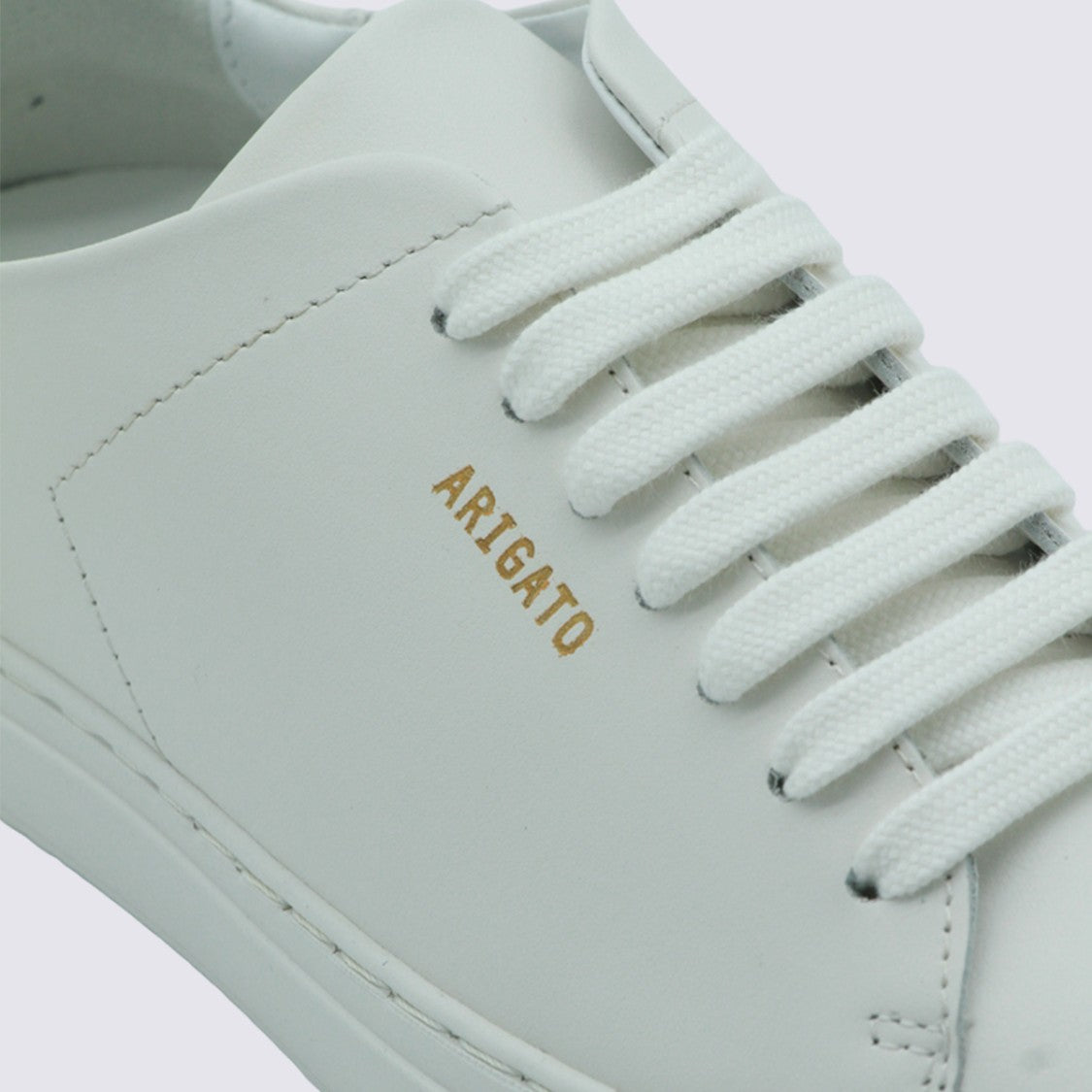 Axel Arigato Minimalist White Sneakers With Gold Accents