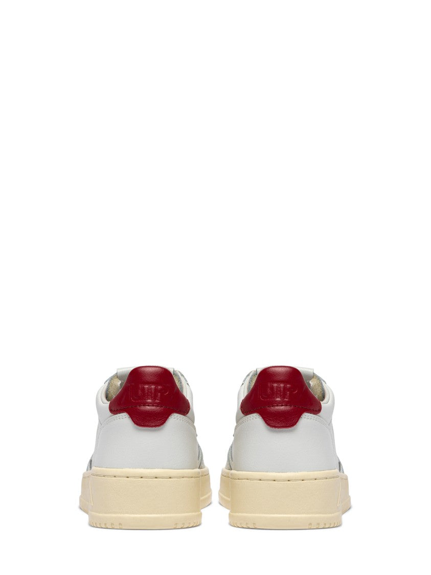 Autry Low-Top Leather Sneakers With Perforated Detailing And Claret Accents
