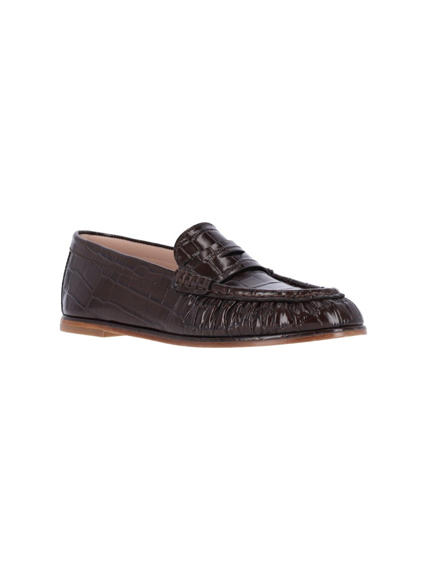 Stuart Weitzman Crocodile-Embossed Loafer Flats With Glossy Finish