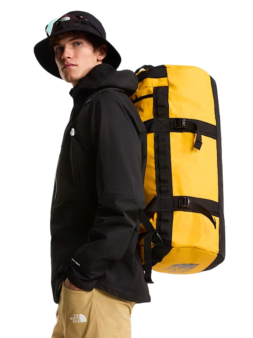 The North Face Cylindrical Yellow Duffel Bag With Black Accents