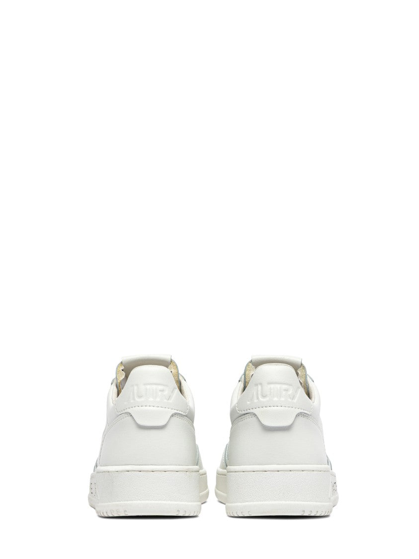 Autry Low-Top Leather Sneakers With Perforated Detailing And Unique Sole Accents